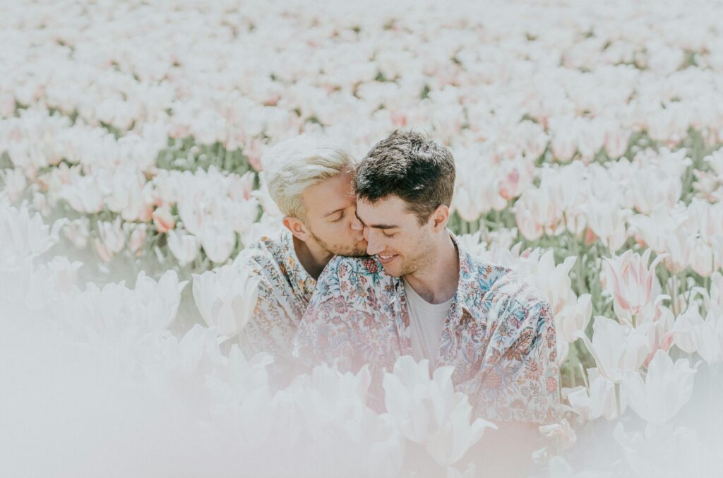 pexels photo 2432298 2432298 A joyful couple sharing a tender moment in a sunlit tulip field.